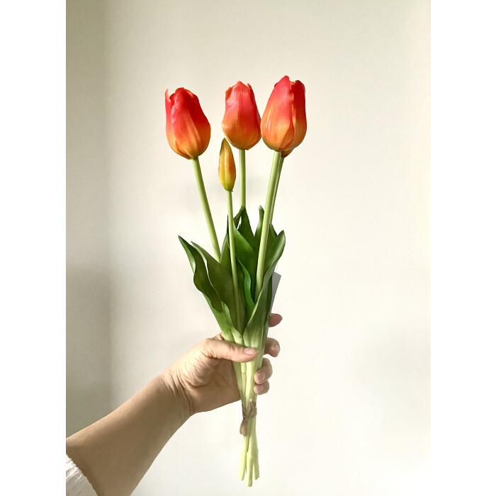 A bouquet of orange latex tulips