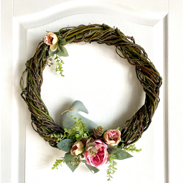 Spring wreath with a bird